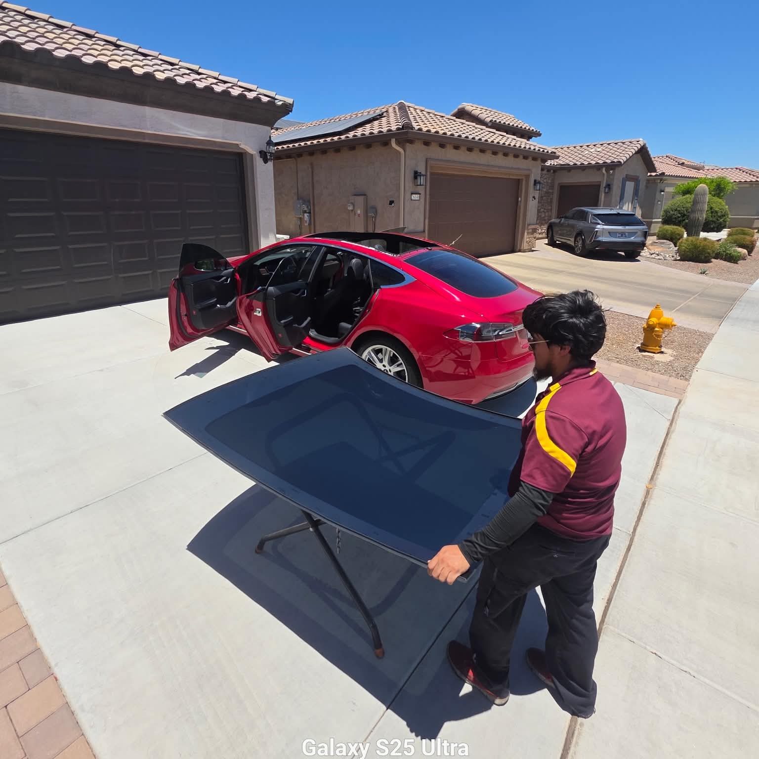 Carrying a new windshield to a Tesla Model S